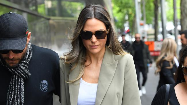 Sarah Gatto (centre), wife of Danny Awad departs the County Court of Victoria in 2019 after her husband, Danny Awad, was sentenced to 15 years jail.