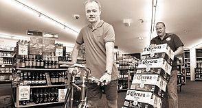 RISKY BUSINESS: Charlie's Hotel publican Scott Davy (front) in the bottle shop, which is still prone to Mary River flooding. Picture: Contributed