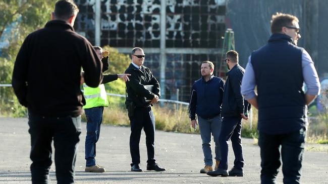 Police and City of Greater Geelong staff at the site of a building fire behind Osborne House. Picture: Alison Wynd