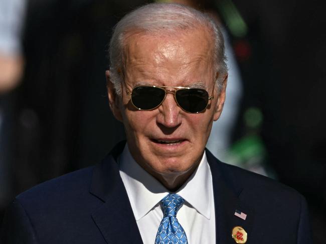 TOPSHOT - US President Joe Biden is pictured after the group photo at the end of the first session of the G20 Leaders' Meeting in Rio de Janeiro, Brazil, on November 18, 2024. (Photo by Mauro PIMENTEL / AFP)