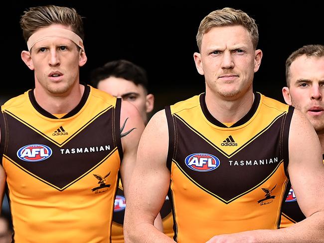 MELBOURNE, AUSTRALIA - APRIL 30: James Sicily of the Hawks leads his team out onto the field during the round seven AFL match between the Melbourne Demons and the Hawthorn Hawks at Melbourne Cricket Ground on April 30, 2022 in Melbourne, Australia. (Photo by Quinn Rooney/Getty Images)