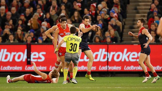 Callum Mills lays stunned on the MCG turf after receiving a blow from Tomas Bugg. Picture: Getty Images