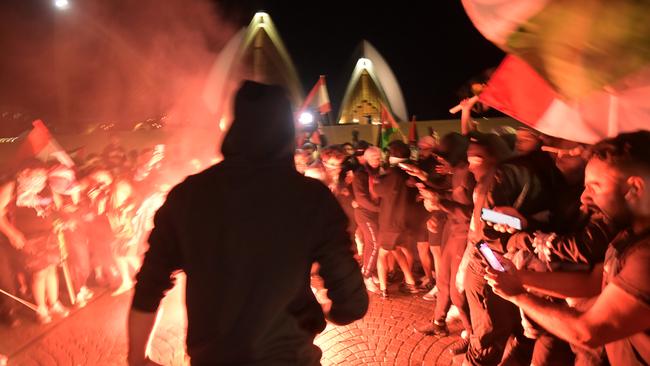 Flares were set off protest on the forecourt of the Opera House in Sydney during the rally. Picture: NCA NewsWire / Jeremy Piper