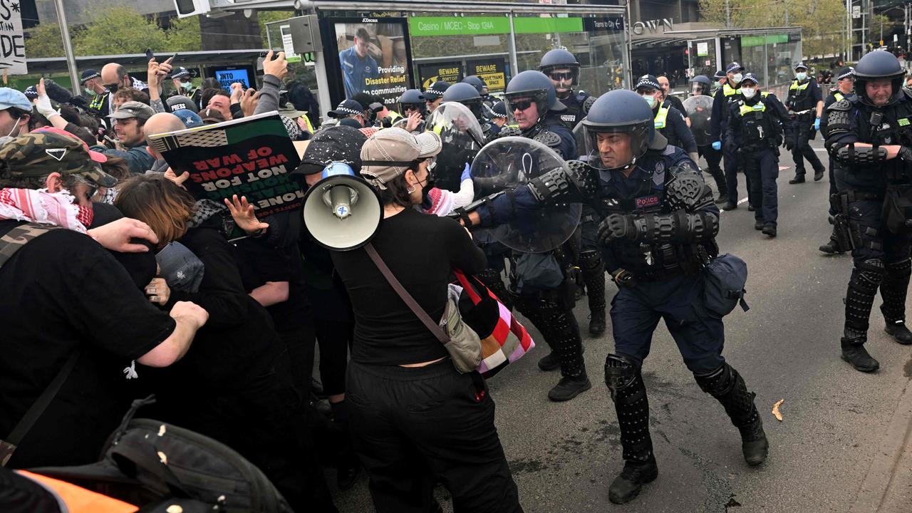 Specially trained riot police control the crowd. Picture: William West / AFP