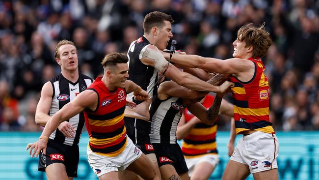 Ben Keays removes the glasses of Mason Cox. Picture: Michael Willson