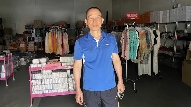 Will Li surveys the damage to his Sunshine Fashion wholesale clothing business.