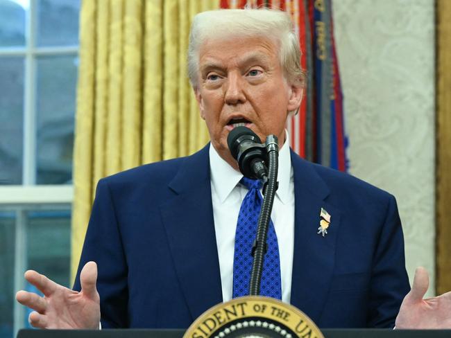 US President Donald Trump speaks after Tulsi Gabbard was sworn in as Director of National Intelligence (DNI) in the Oval Office of the White House in Washington, DC, on February 11, 2025. The Republican-controlled US Senate confirmed Tulsi Gabbard earlier as Trump's choice to lead the country's intelligence services, despite criticism over her lack of experience and past support for Russia and Syria. Gabbard -- appointed to be director of national intelligence -- has faced questions over her 2017 meeting with now-deposed Syrian leader Bashar al-Assad and her peddling of Kremlin propaganda, particularly false conspiracy theories about the Ukraine war. She is also regarded with suspicion over her views on US government surveillance and her backing for National Security Agency (NSA) leaker Edward Snowden, seen on both sides of Congress as having imperiled Americans' safety. (Photo by ANDREW CABALLERO-REYNOLDS / AFP)