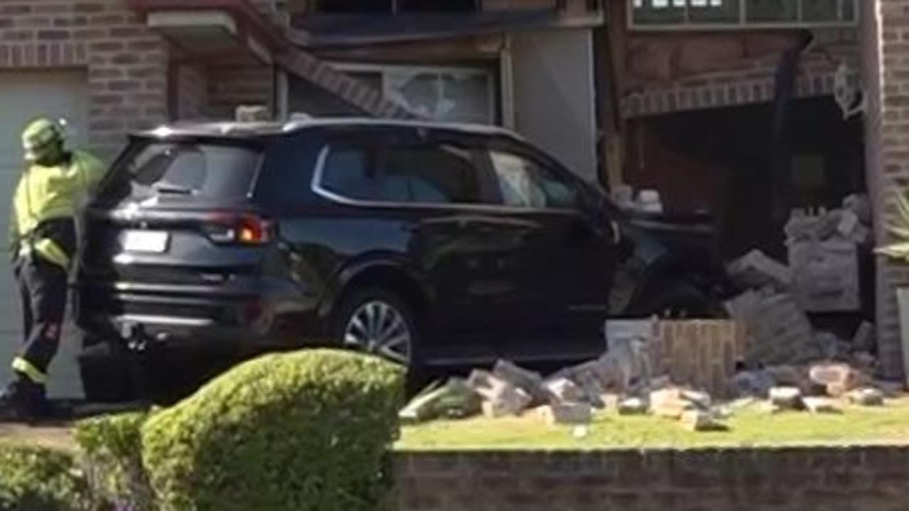 Driver miraculously escapes after car smashes into Sydney home