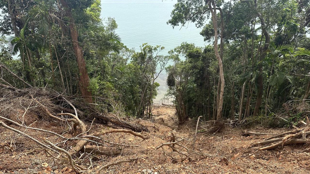 Landslides run for hundreds of metres down cliff faces and into the ocean on the Bloomfield Track between Wujal Wujal and Cape Tribulation.