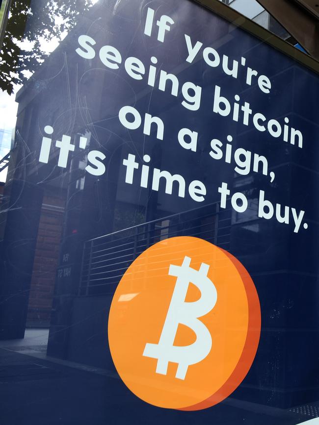 A cryptocurrency advertisement on a bus shelter in Sydney. Picture: NCA NewsWire/Joel Carrett