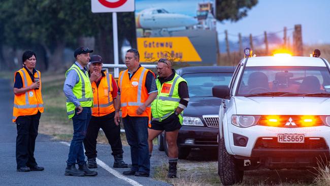 Authorities guard the entrance to Whakatane Airport. Picture: AAP