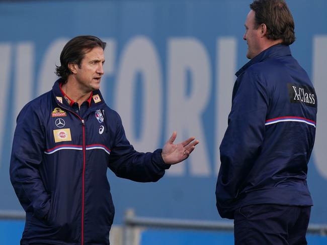 Bulldogs head coach Luke Beveridge speaks to football director Chris Grant during an AFL Western Bulldogs training session at VU Whitten Oval in Melbourne, Tuesday, June 23, 2020. (AAP Image/Michael Dodge) NO ARCHIVING