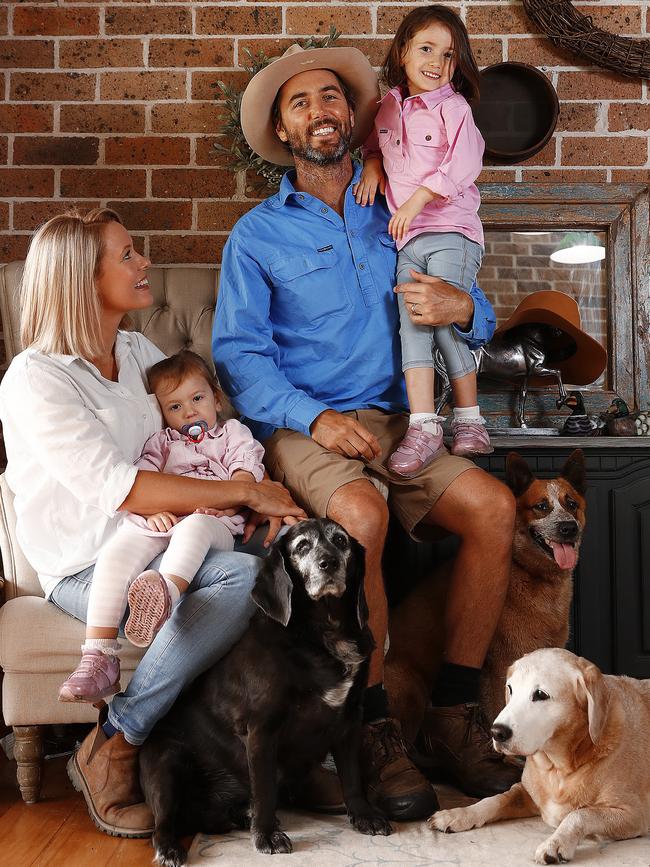 Luke and Sam with Elle and Evie and their dogs Wallace, Charlie and Tilly who helped inspire the farm’s activities. Picture: Sam Ruttyn