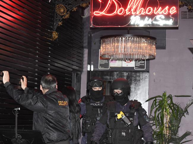 Police raid the Dollhouse strip club in 2016. Picture: Gordon McComiskie