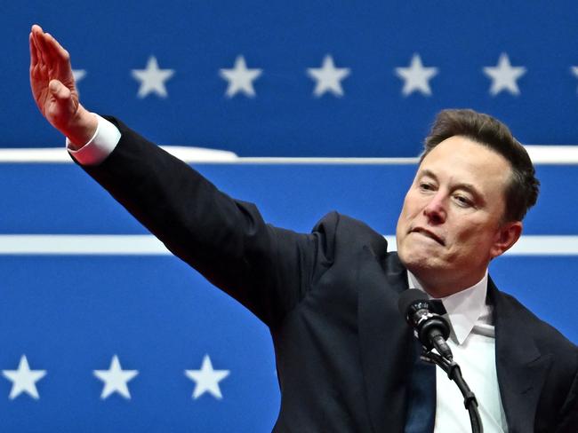 Tesla and SpaceX CEO Elon Musk gestures as he speaks during the inaugural parade inside Capitol One Arena, in Washington, DC, on January 20, 2025. (Photo by ANGELA WEISS / AFP)