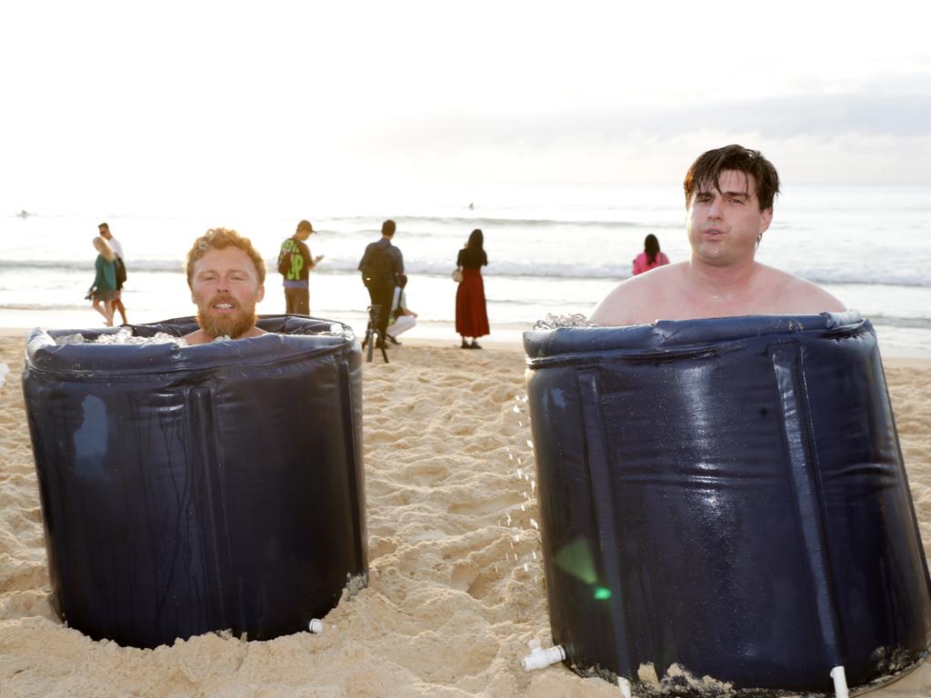 Andre Garraud and Quinn O’Donnell from Conscious Community take their first ice bath of 2025. Picture: NewsWire / Christian Gilles