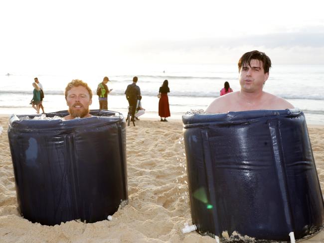 Andre Garraud and Quinn O’Donnell from Conscious Community take their first ice bath of 2025. Picture: NewsWire / Christian Gilles