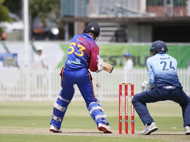 Xander Carstens prepares to cut as Parramatta keeper Charlie Akle watches on. Picture Warren Gannon Photography