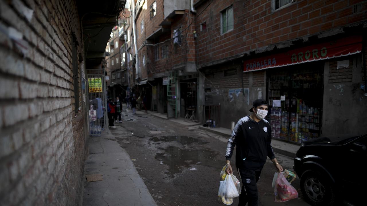 A man walks on a street after shopping during a government-ordered lockdown in Buenos Aires, Argentina on Sunday, April 26, 2020. Picture: Natacha Pisarenko/AP