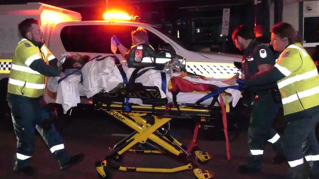 An alleged hit and run crash outside a pub has left a young man fighting for life and four other people injured., , Just after 1.30am on Saturday morning, a blue Ford sedan ploughed into a group of people out the front of the pub Royal Family Hotel on NorthTce in Port Elliot Picture: Gary Juleff