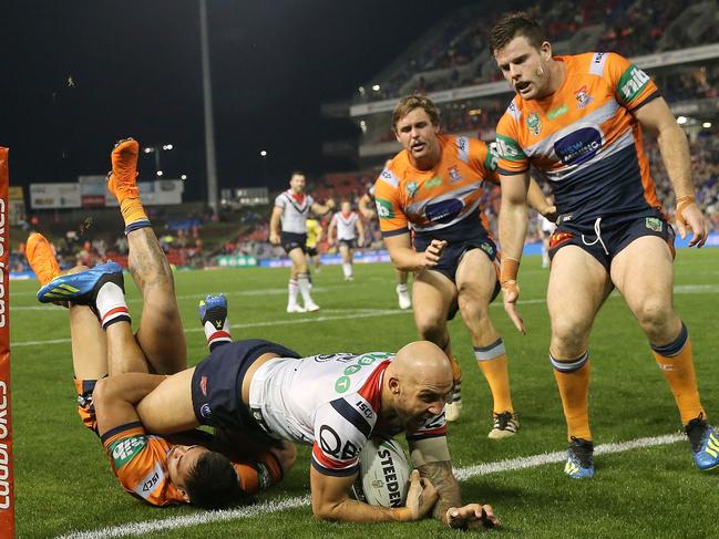 Blake Ferguson crashes over against the Knights. Picture: Getty Images