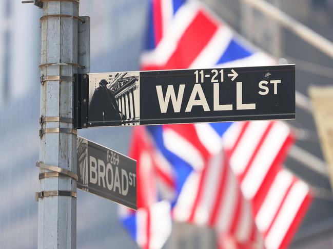 NEW YORK, NEW YORK - SEPTEMBER 13: The Wall Street street sign is seen at the New York Stock Exchange during afternoon trading on September 13, 2022 in New York City. U.S. stocks opened lower today and closed significantly low with the Dow Jones dropping over 1,200 points after the release of an inflation report that showed prices rising more than expected in the last month. The Consumer Price Index released by the Bureau of Labor Statistics showed prices rising 8.3% over the last year, for which economists had predicted an 8.1% increase.   Michael M. Santiago/Getty Images/AFP