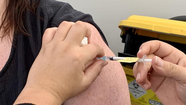 Daily Mercury editor Rae Wilson getting her Covid-19 Pfizer vaccination at the new vaccination hub at CQUniversity's Mackay city campus.