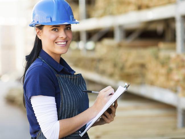 pretty female hardware store worker working in warehouse