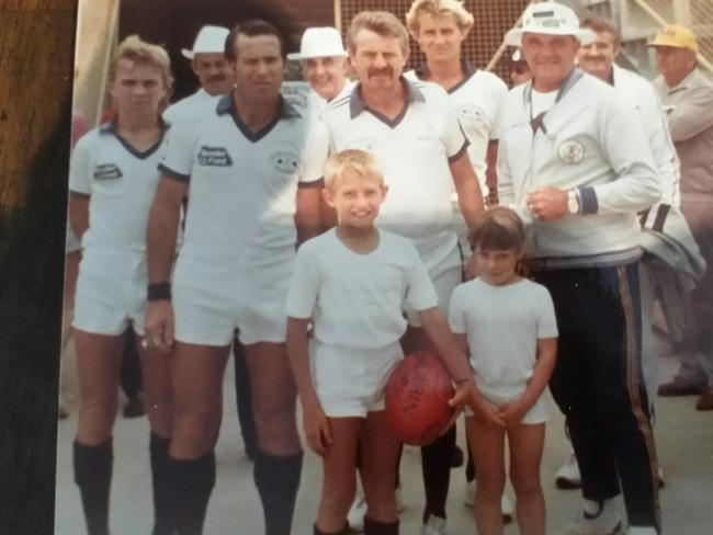 Billy Connell (not pictured) was involved with Australian rules umpiring in the 1970s. Son Chris and daughter Kirsty pictured as mascots in front of some umpires. Picture: Supplied.