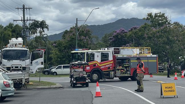 Emergency services including firefighters, police and paramedics and Ergon Energy workers attended a two vehicle crash which involved one car also hitting a street pole in North Cairns on November 9, 2022. Picture: Alison Paterson