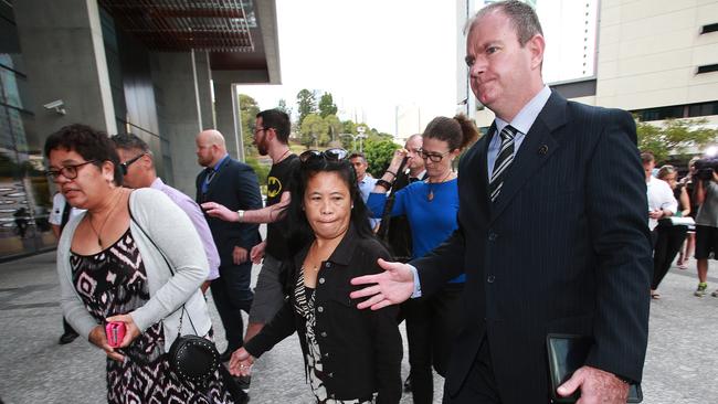 Detective Inspector Damien Hansen escorts members of the Wright family, and friends, from the Brisband Supreme Court. PIC: Claudia Baxter