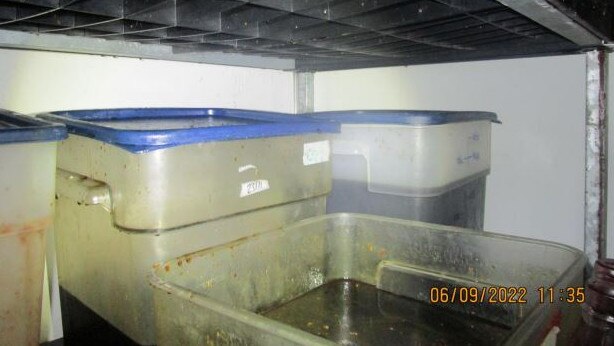 Mould and other unidentified visible matter on the shelving in the cold room.