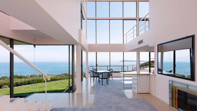 Huge windows show off coastal views.