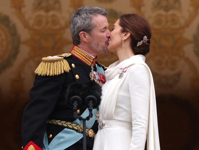 COPENHAGEN, DENMARK - JANUARY 14: Danish King Frederik X kisses his wife Queen Mary of Denmark after his proclamation by the Prime Minister, Mette Frederiksen on the balcony of Christiansborg Palace on January 14, 2024 in Copenhagen, Denmark. King Frederik X is succeeding Queen Margrethe II, who will be stepping down after reigning for 51 years. (Photo by Sean Gallup/Getty Images)