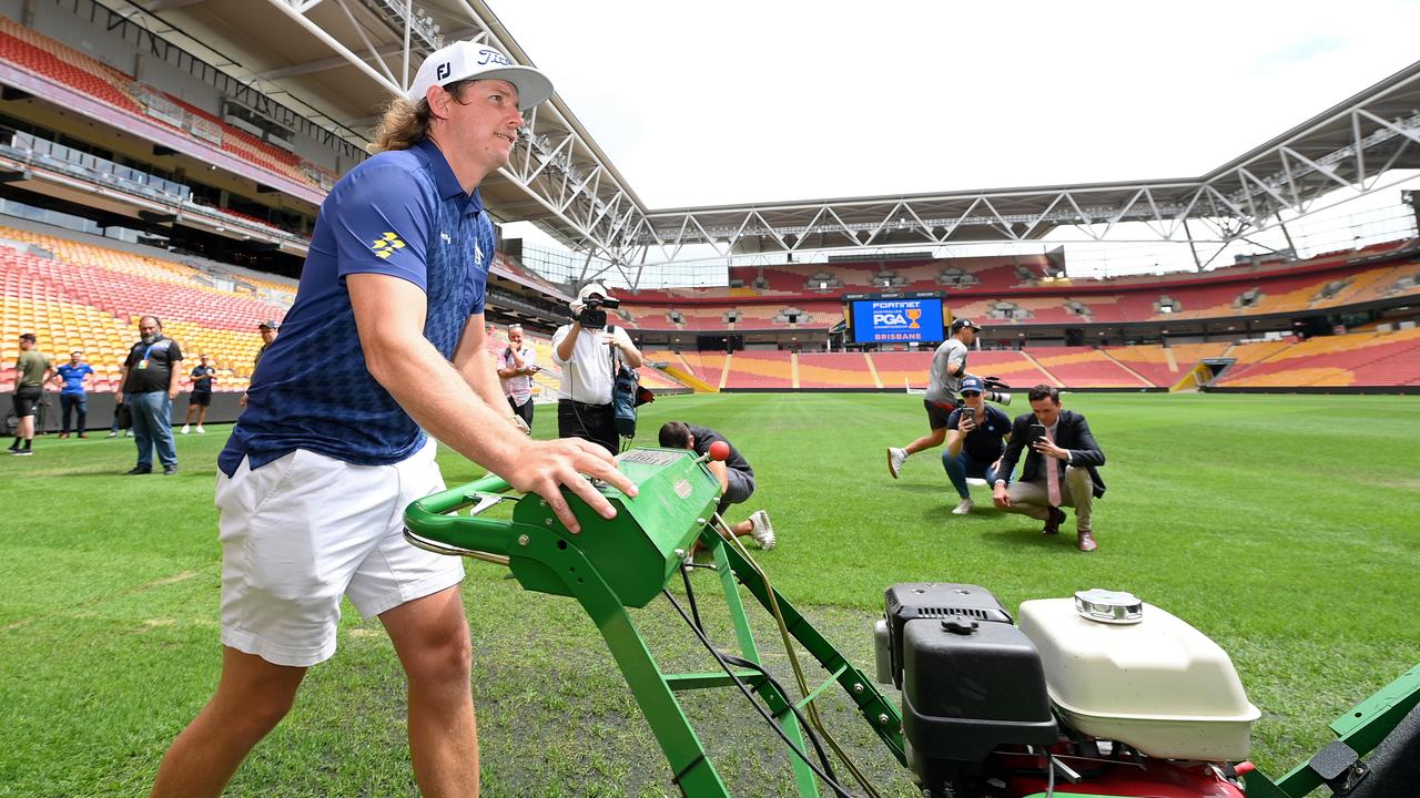 Smith competes in a mowing challenge against fellow Australian golfer Marc Leishman at Suncorp Stadium ahead of the 2023 Australian PGA Championship. Picture: Bradley Kanaris/Getty Images