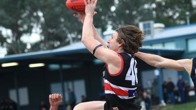 Daniel Gorringe flies for a mark for Park Orchards. Picture: Davis Harrigan