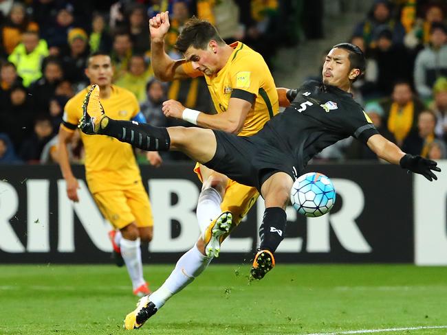 MELBOURNE, AUSTRALIA - SEPTEMBER 05:  Tomi Juric of the Socceroos has his shot on goal deflected by Adison Promrak of  Thailand and past goalkeeper Sinthaweechai Hathairattanakool of Thailand during the 2018 FIFA World Cup Qualifier match between the Australian Socceroos and Thailand at AAMI Park on September 5, 2017 in Melbourne, Australia.  (Photo by Scott Barbour/Getty Images)