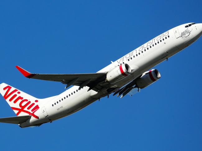 SYDNEY, AUSTRALIA - NewsWire Photos MARCH 24, 2021: An Aerial view of a Virgin Plane taking off from the Domestic Airport in Sydney Australia. Picture: NCA NewsWire / Gaye Gerard