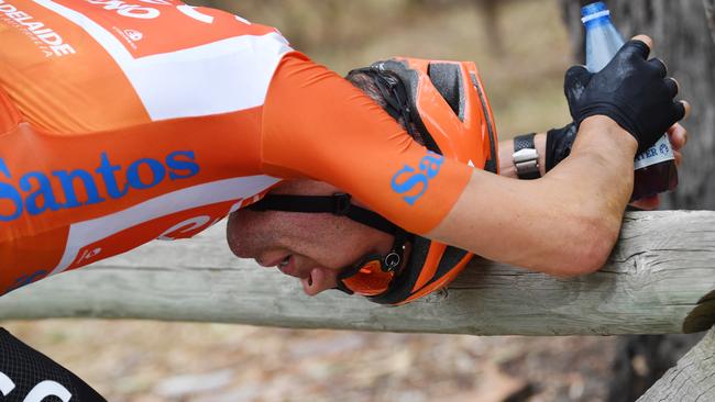 A dejected Patrick Bevin is seen after stage four of the Tour Down Under from Unley to Campbelltown in South Australia, Friday, January 18, 2019. (AAP Image/David Mariuz) NO ARCHIVING, EDITORIAL USE ONLY