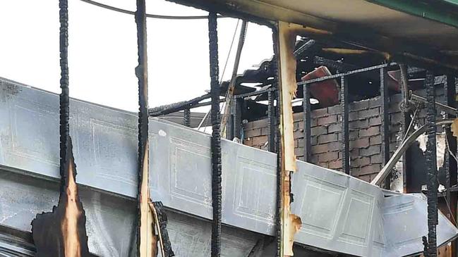 The charred house. Picture: Patrick Woods.