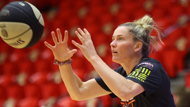 PERTH, AUSTRALIA - MARCH 03: Sami Whitcomb of the Fire reaches for the ball as she warm's up before game two of the WNBL Semi Final series between Perth Lynx and Townsville Fire at Bendat Basketball Stadium, on March 03, 2024, in Perth, Australia. (Photo by James Worsfold/Getty Images)