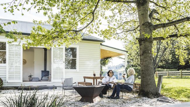 The cottage’s alfresco dining area under the old oak tree is a great spot to enjoy a lovely drop of Home Hill wine and chill out. Picture: Joe Chelkowski