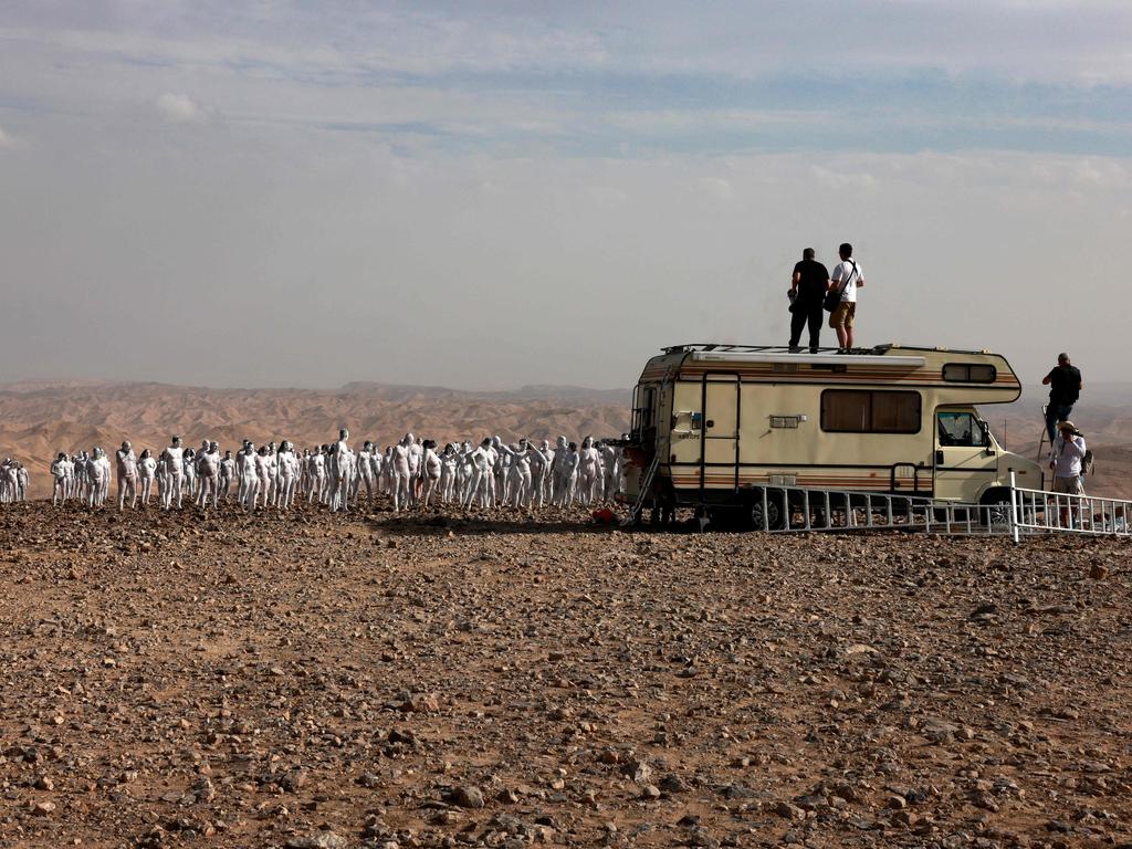 Spencer Tunick and his crew working with the models. Picture: Menahem Kahana/AFP