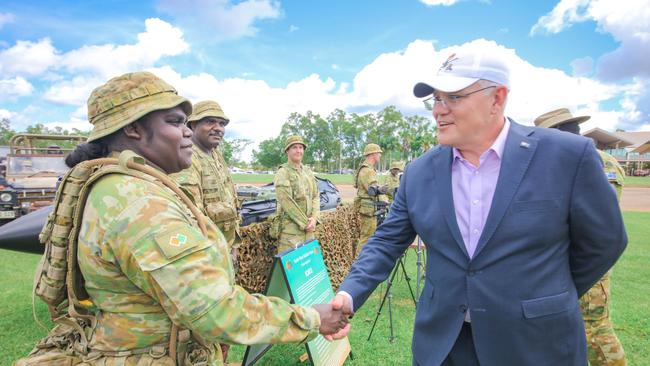 Prime Minister Scott Morrison with NORFORCE Private Sally Anne Nilco from Belyuen during his visit to Darwin's Robertson Barracks yesterday. Picture Glenn Campbell