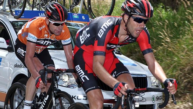 Cadel Evans fights to get back to the peloton after stopping for a bike change after he lost his chain. Picture: Sarah Reed