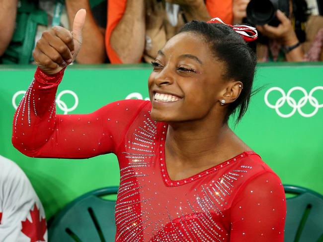 Under Armour has a deal to outfit the USA Gymnastics team but Simone Biles wore Nike on the podium when collecting her golds. Picture: Alex Livesey/Getty Images