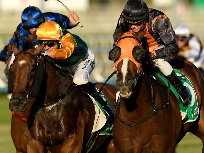 Jockey Jackson Murphy rides Benfica Princess (right) to victory in race 8, the BenchMark 80 Handicap, during Saturday Raceday at Eagle Farm Racecourse in Brisbane, Saturday, March 21, 2020. (AAP Image/Albert Perez) NO ARCHIVING, EDITORIAL USE ONLY