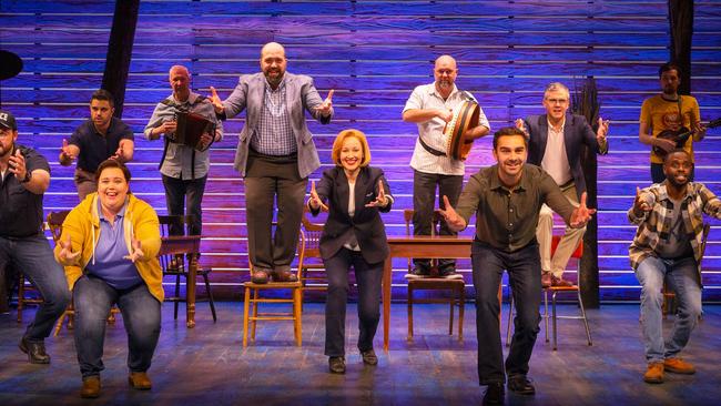 The cast of Come From Away in action.