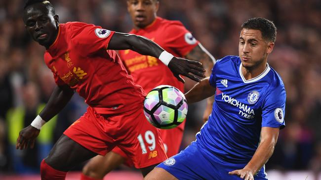 LONDON, ENGLAND - SEPTEMBER 16: Sadio Mane of Liverpool and Eden Hazard of Chelsea battle for the ball during the Premier League match between Chelsea and Liverpool at Stamford Bridge on September 16, 2016 in London, England. (Photo by Shaun Botterill/Getty Images)