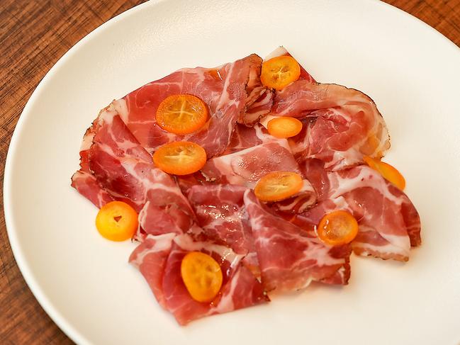 Capocollo with pickled cumquats. Picture: Ian Currie